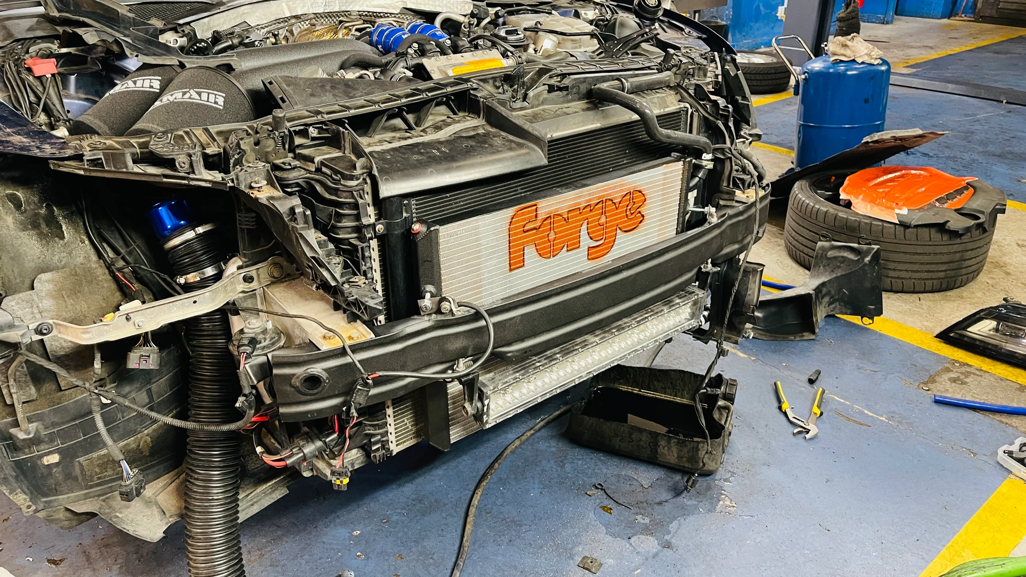 The Monsta S7 with its front bumper removed, showing the charge-cooling installation.