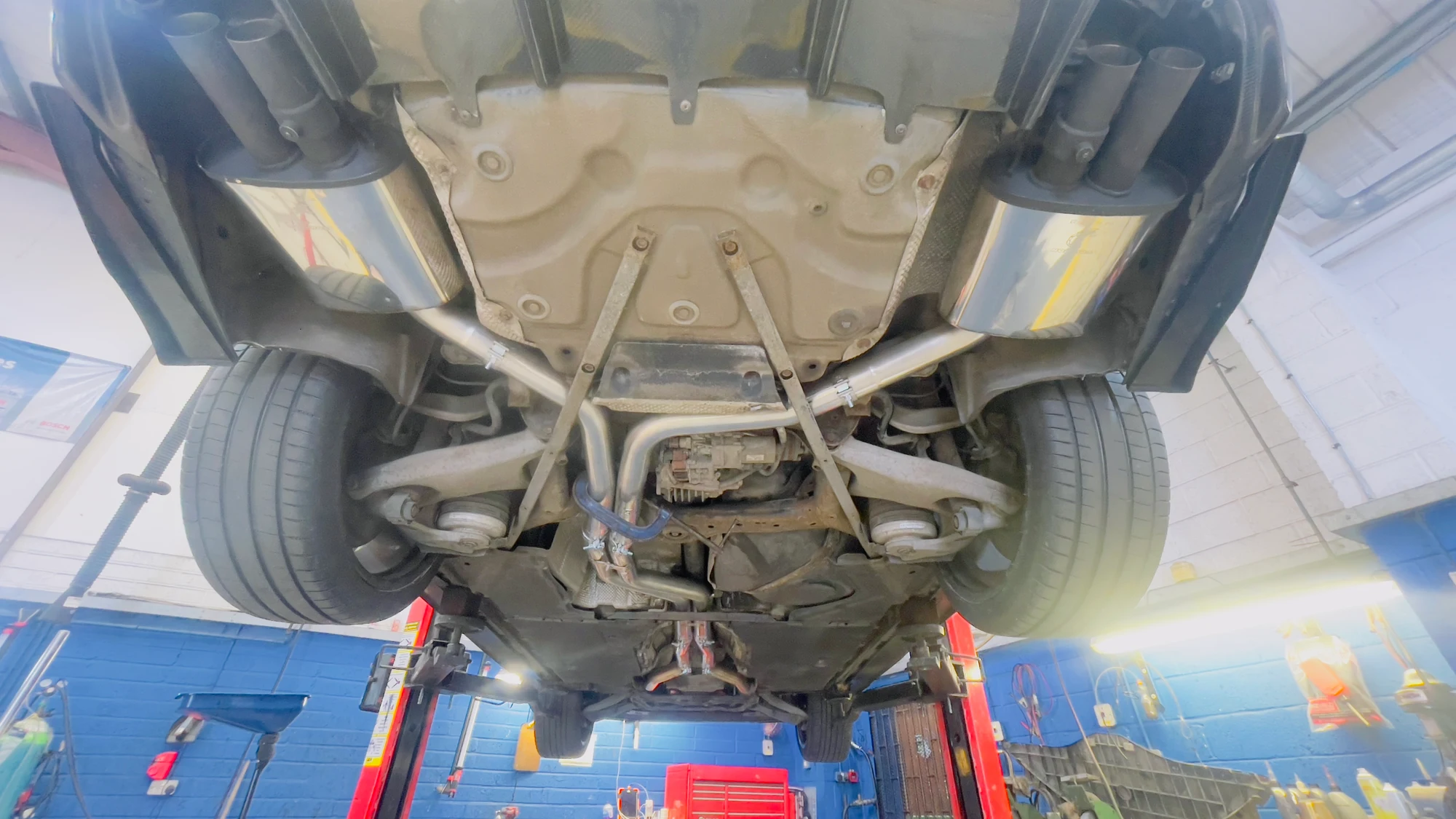 The S7 exhaust layout on the lift—details that a finished-car photograph cannot show.